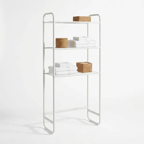 Three-tier metal shelf standing over a toilet holding towels and baskets